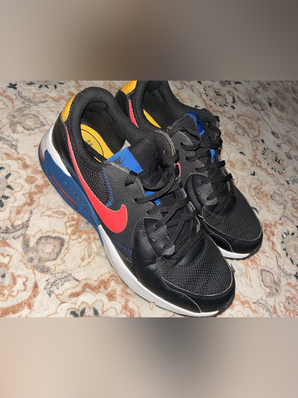 Nike Kids Black Sneakers with Red Swoosh and Blue & Yellow Accents